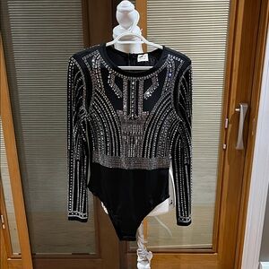Blue Buttercup Crystal embellished black bodysuit. Size small